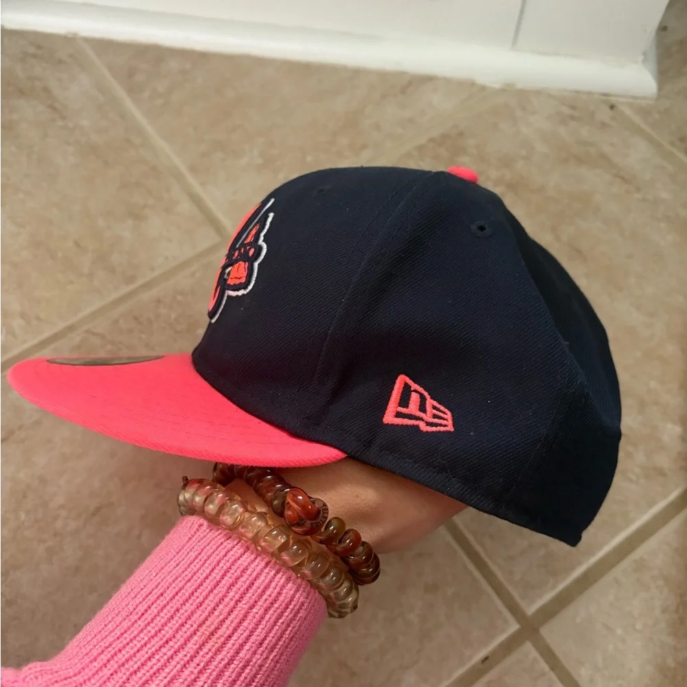 New Era Atlanta Braves 9FIFTY snapback hat in navy and vibrant pink colorway